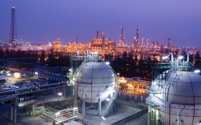 Gas storage spheres tank in petrochemical plant at night